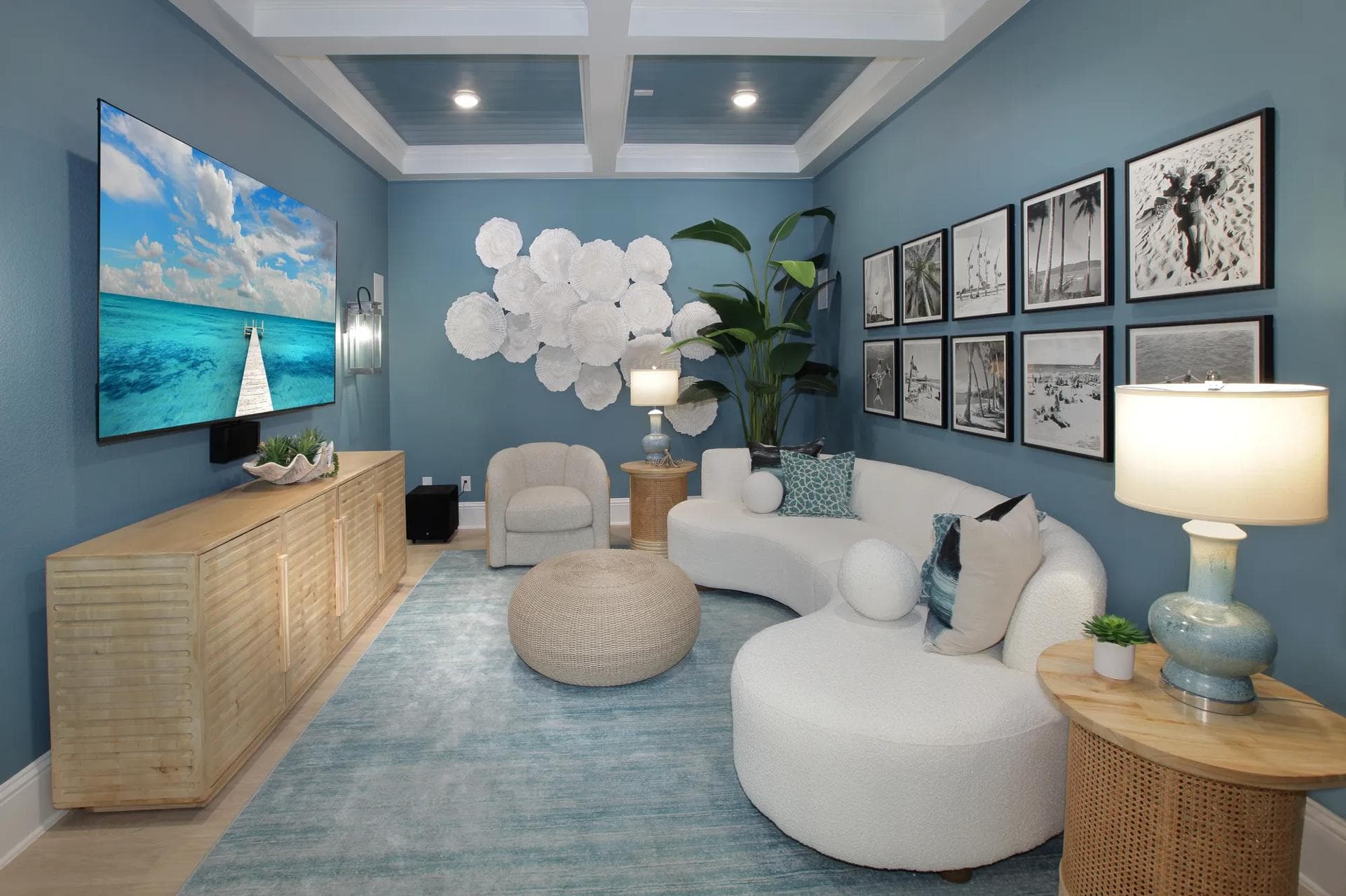 Media room with a coffered ceiling