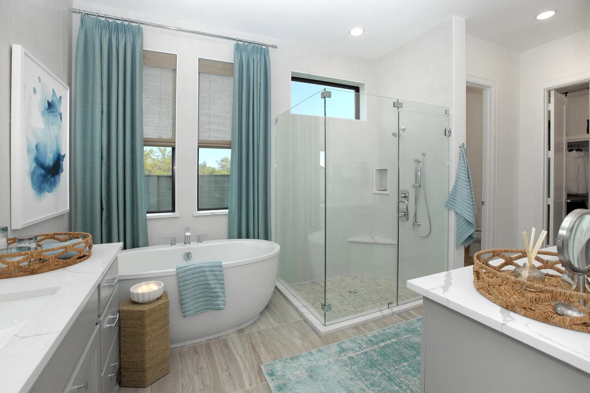 Primary bathroom with a freestanding tub and glass shower