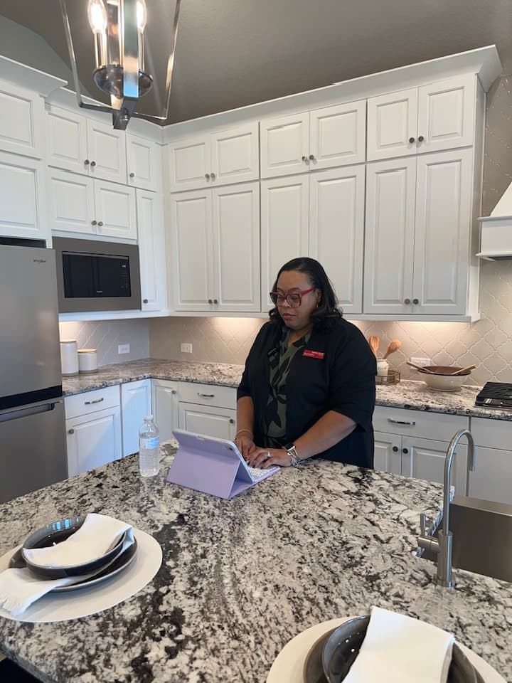 Tamika Scott working at a model home in Greater Houston